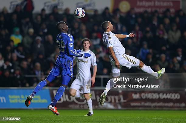 Demba Ba of Chelsea and Ashley Williams of Swansea City