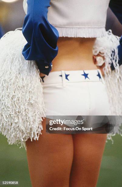 Dallas Cowboys cheerleader stands on the field during Super Bowl XIII featuring the Pittsburgh Steelers and the Dallas Cowboys at the Orange Bowl on...