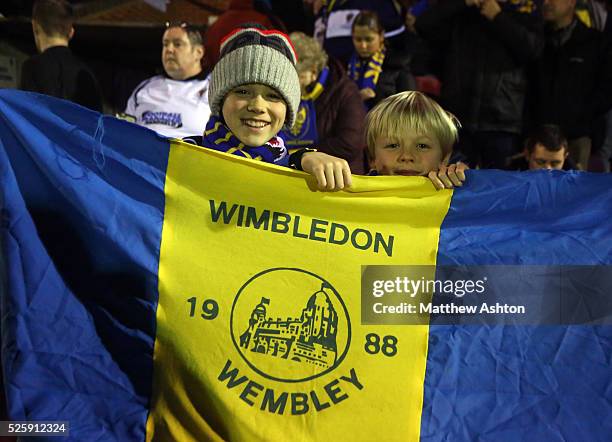 Fans of AFC Wimbledon with a flag from the 1988 FA Cup Final against Liverpool at Wembley
