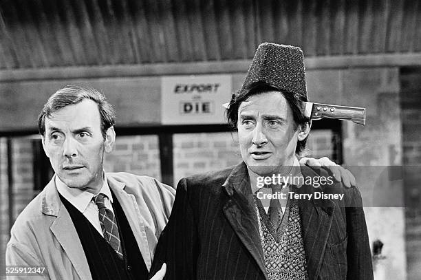 English actor Eric Sykes with Irish comedian, actor, and poet Spike Milligan on the set of the London Weekend Television sitcom 'Curry and Chips',...