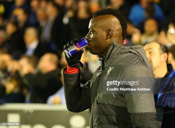 Mario Balotelli of Liverpool has a drink of Red Bull