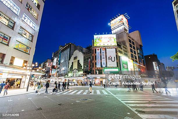 busy illuminated crossroad in the downtown of kanazawa, hokuriku region, japan - kanazawa stock pictures, royalty-free photos & images