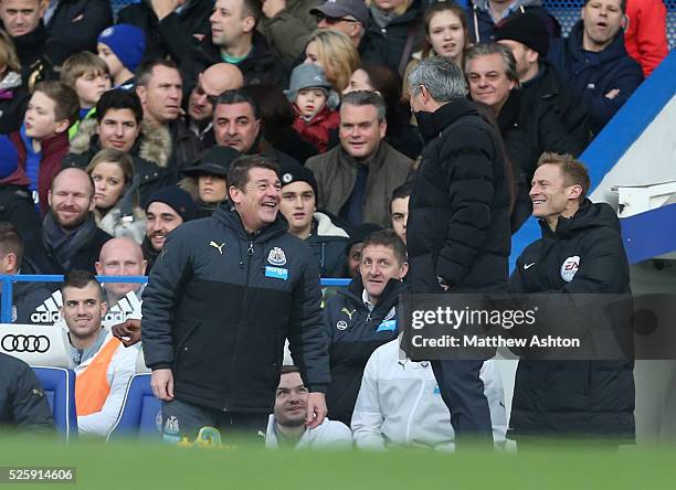 Jose Mourinho the head coach / manager of Chelsea shares a joke with John Carver caretaker manager of Newcastle United in the first half