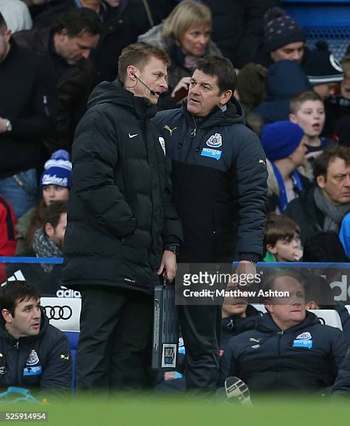 John Carver caretaker manager of Newcastle United speaks with fourth official Mike Jones