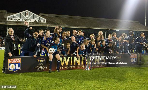 Olympique Lyonnais celebrate infront of the winners board with the Womens UEFA Champions League Trophy