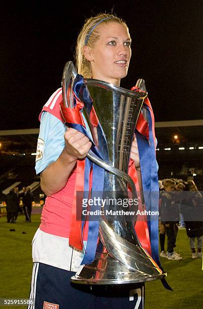 Lara Dickenmann of Olympique Lyonnais celebrates with the Womens UEFA Champions League Trophy
