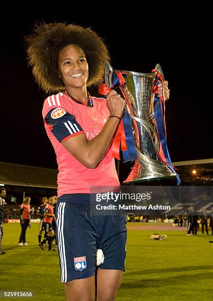 Wendie Renard of Olympique Lyonnais celebrates with the Womens UEFA Champions League Trophy