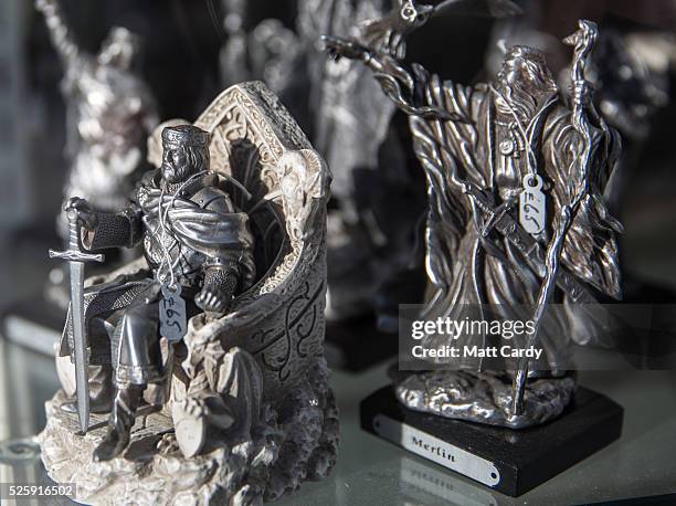 Merchandise inspired by the legend of King Arthur is displayed in the window of a shop in Tintagel on April 27, 2016 in Cornwall, England.The English...