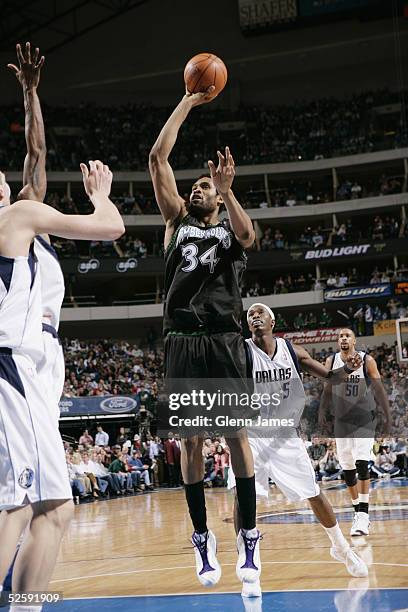 Michael Olowokandi of the Minnesota Timberwolves shoots during the game against the Dallas Mavericks at American Airlines Arena on March 15, 2005 in...