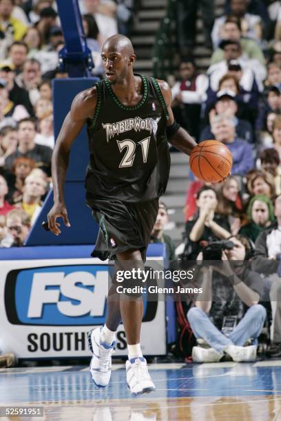 Kevin Garnett of the Minnesota Timberwolves brings the ball upcourt during the game against the Dallas Mavericks at American Airlines Arena on March...