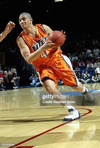 John Tofi of the UTEP Miners moves the ball during the game with the Utah Utes in the first round of the NCAA Men's Basketball Championship on March...