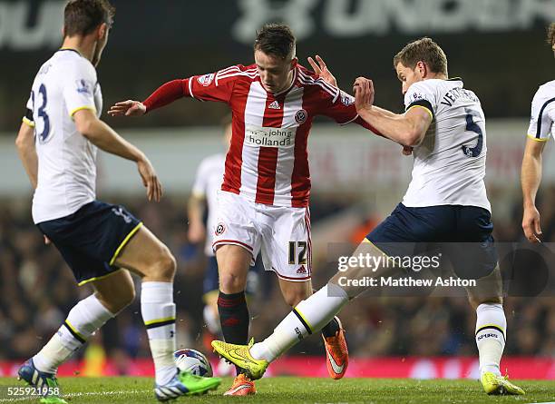 Marc McNulty of Sheffield United is tackled by Ben Davies and Jan Vertonghen of Tottenham Hotspur