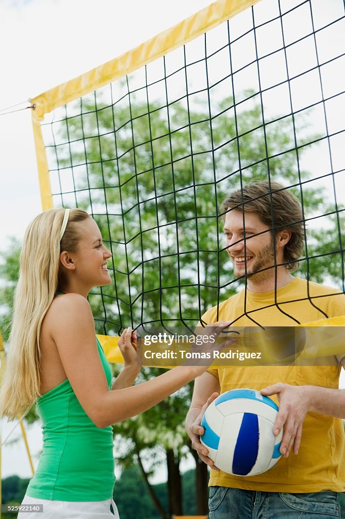 Couple Playing Beach Volleyball