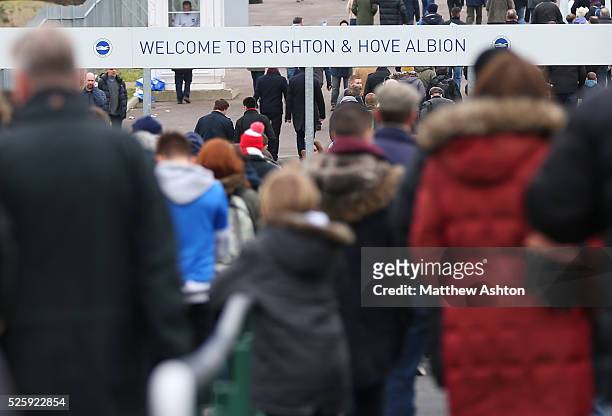 Fans make their way to The American Express Community stadium, home of Brighton & Hove Albion - Amex stadium