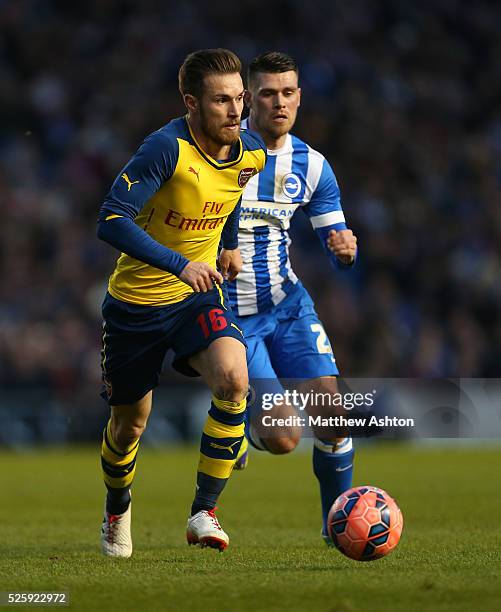 Aaron Ramsey of Arsenal and Danny Holla of Brighton & Hove Albion