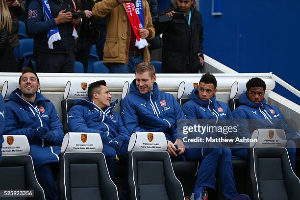 Santi Cazorla, Alexis Sanchez, Per Mertesacker, Francis Coquelin and Chuba Akpom of Arsenal on the bench