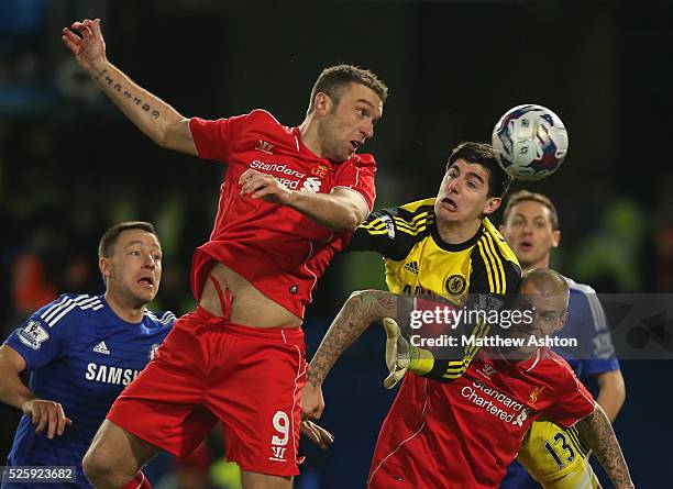 Rickie Lambert of Liverpool beats Thibaut Courtois of Chelsea to the ball but fails to score