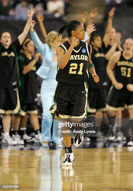 Chameka Scott of the Baylor Lady Bears and her teammates celebrate a three-point basket in the second half against the Michigan State Spartans in the...