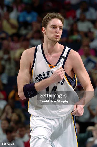 Pau Gasol of the Memphis Grizzlies pounds his chest after making a shot against the Denver Nuggets at FedexForum on April 5, 2005 in Memphis,...