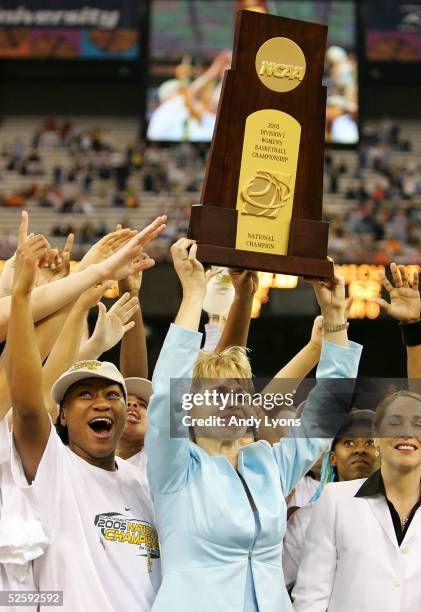 Victoria Jones and head coach Kim Mulkey-Robertson of the Baylor Lady Bears hold up the championship trophy after defeating the Michigan State...