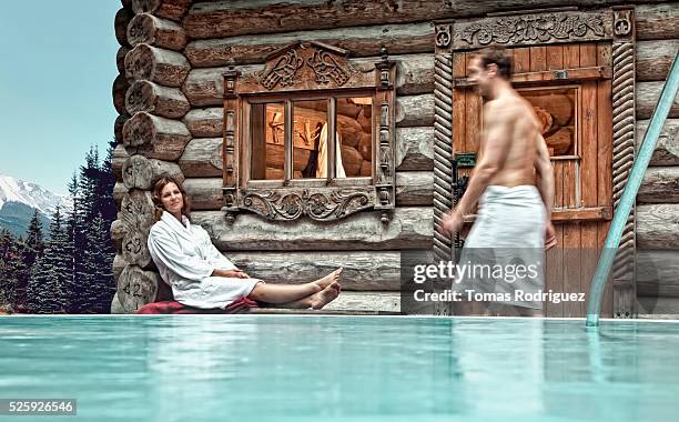 couple relaxing at hot spring - barefoot snow stock pictures, royalty-free photos & images