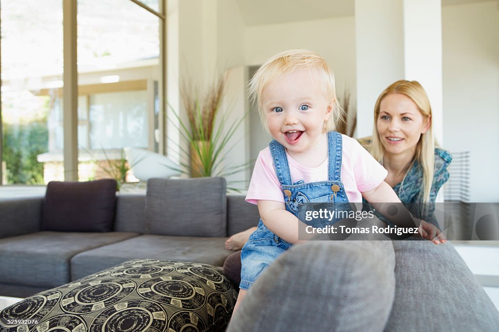 Mother and daughter (12-23 months) at home