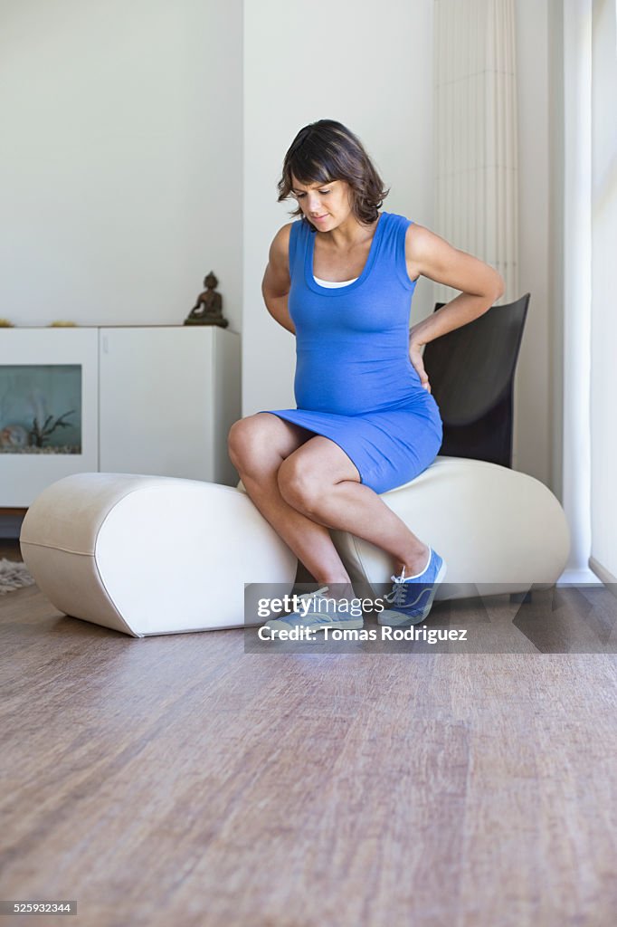 Pregnant woman sitting in chair