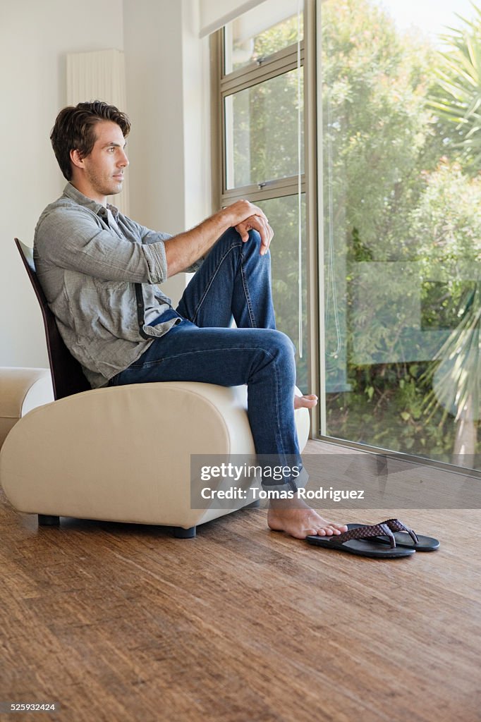 Man relaxing in room