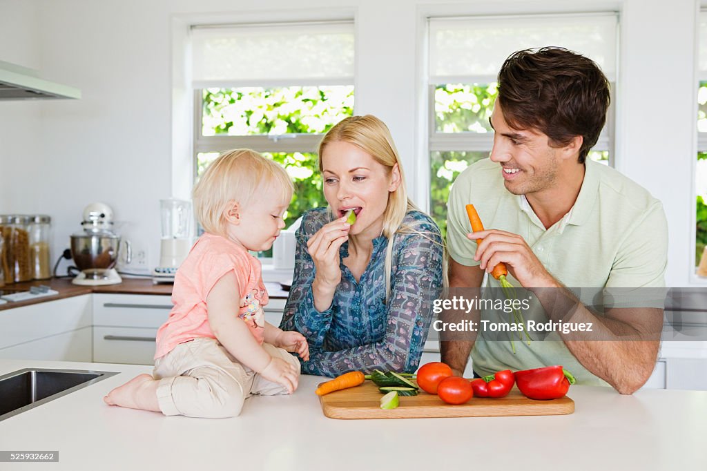 Parents with daughter (12-23 months) in kitchen