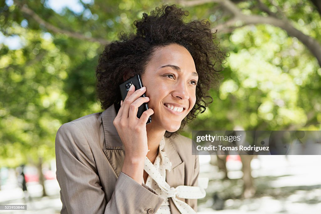 Portrait of mid adult woman talking on phone