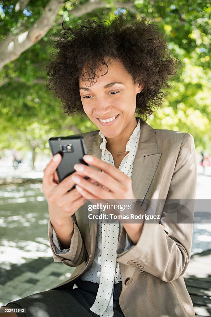 Portrait of mid adult woman using cell phone