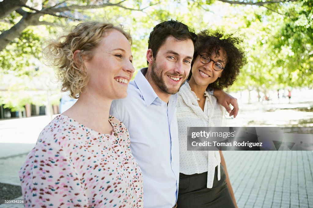 Three friends walking in park