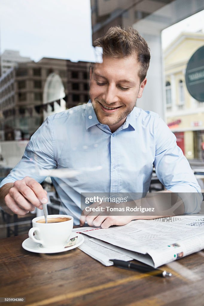 Portrait of mid adult man taking coffee brake