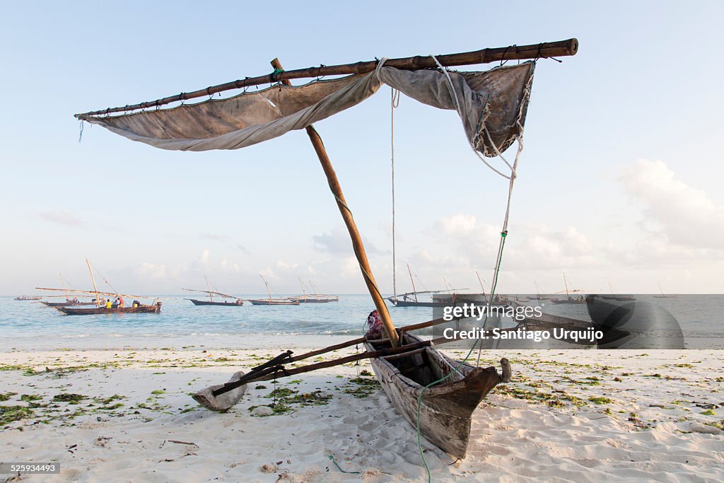 Sailing pirogue moored on the beach