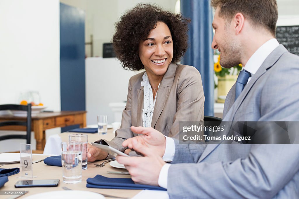 Business people discussing in restaurant