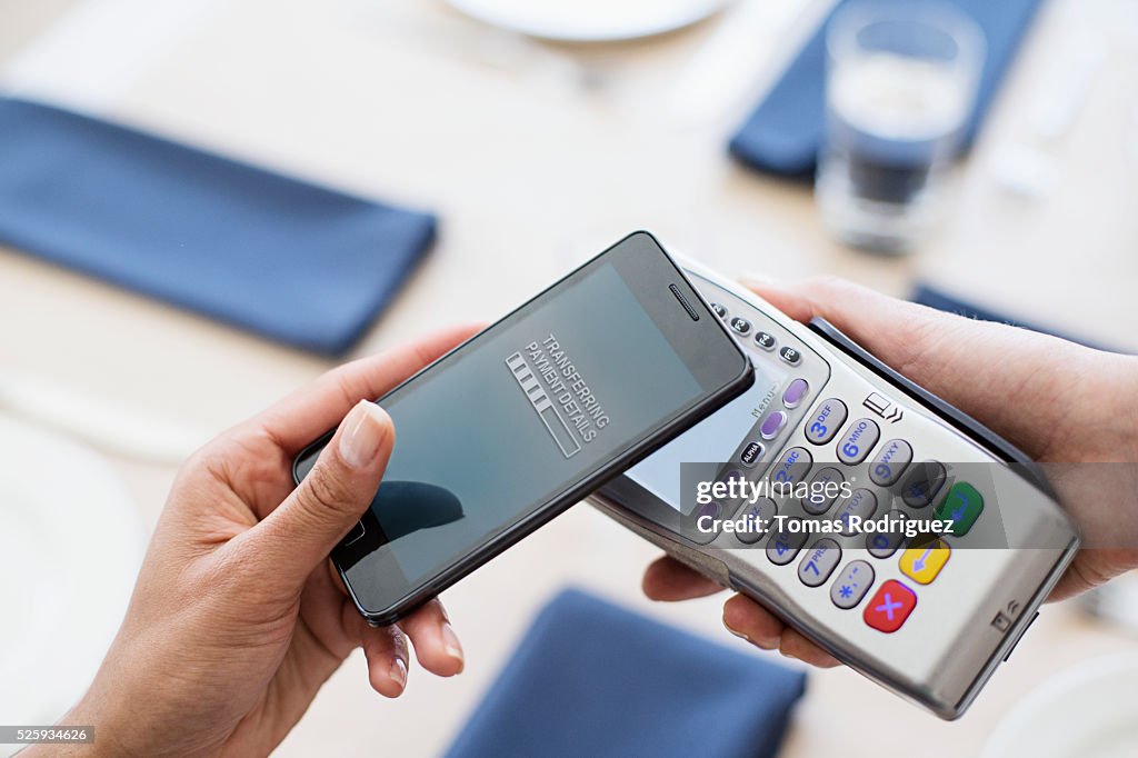 Paying with smartphone in restaurant