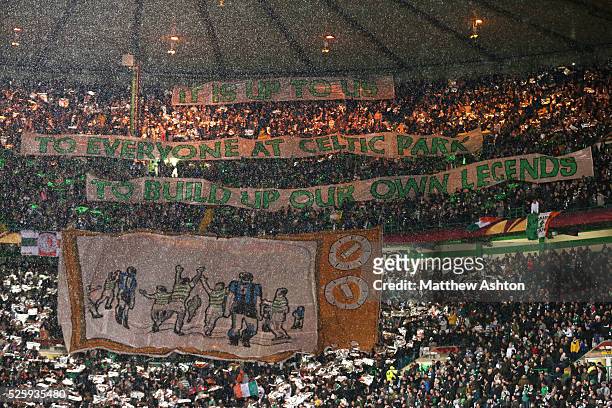 The Celtic Ultras show a banner saying IT IS UP TO US TO EVERYONE AT CELTIC PARK TO BUILD UP OUR OWN LEGENDS with an image of a TV showing Celtic...