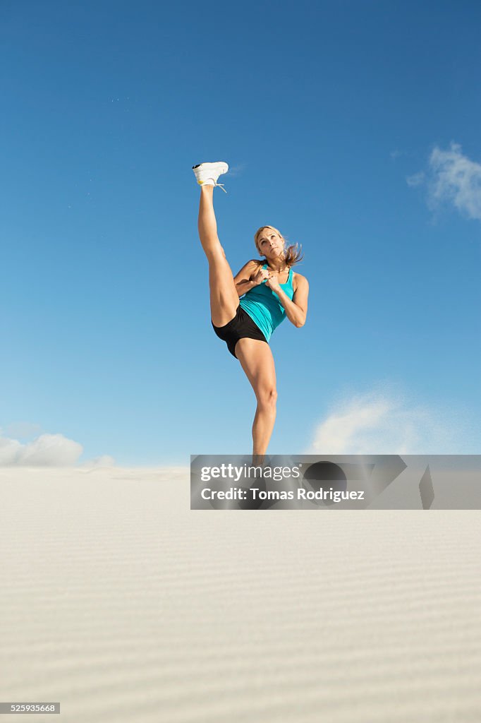 View of, young adult woman, stretching leg