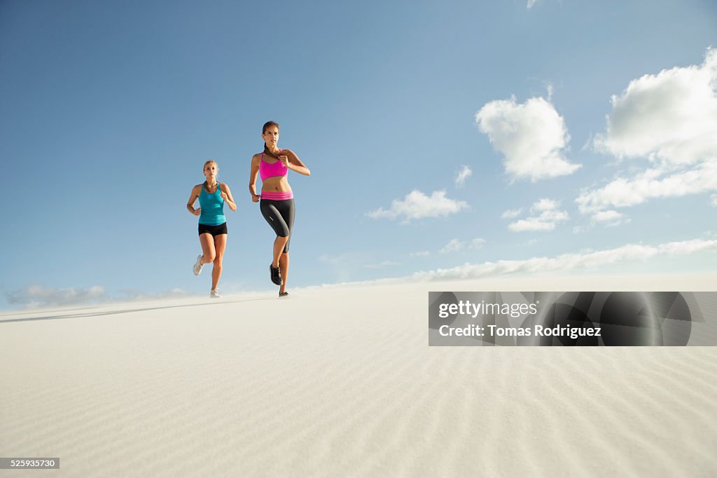 View of two young adult women jogging