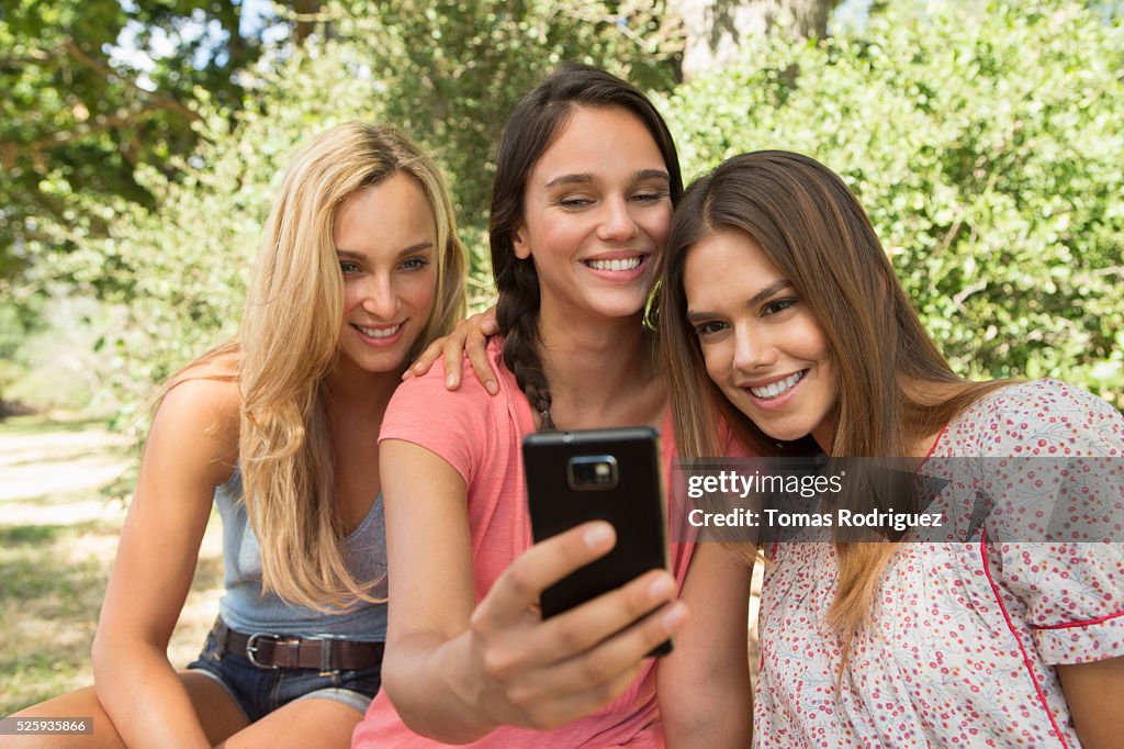 View of young adult woman taking photo