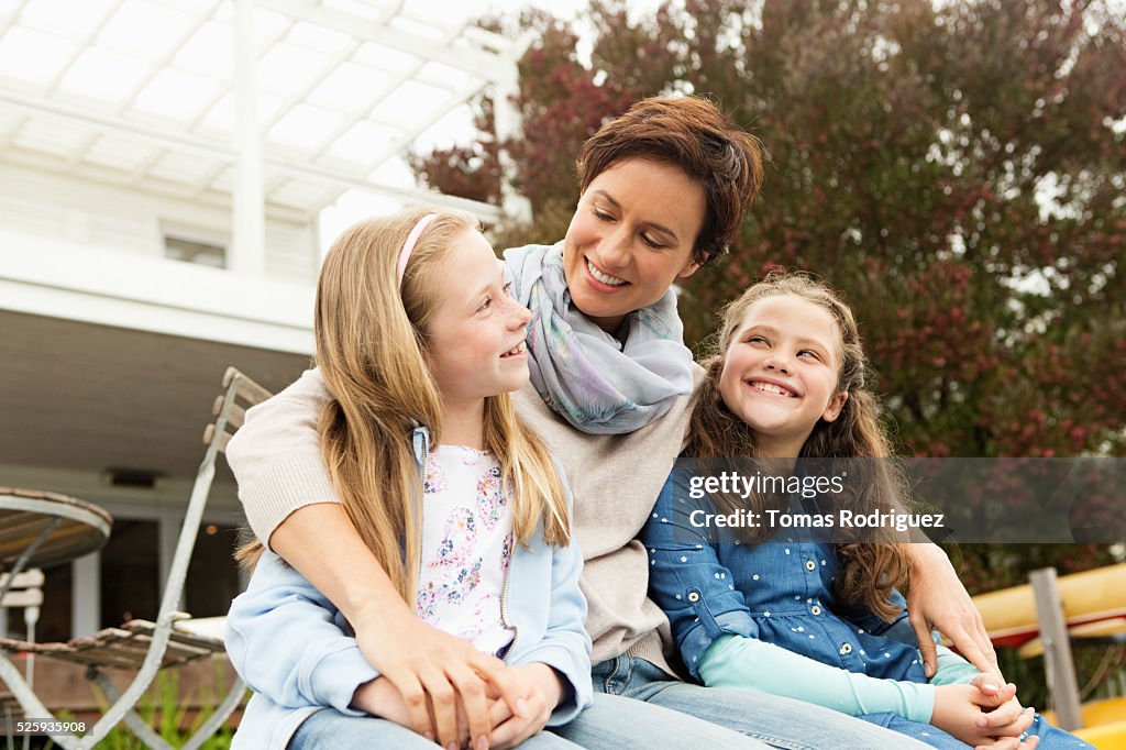 Portrait of mother with two girls (6-7), (8-9)