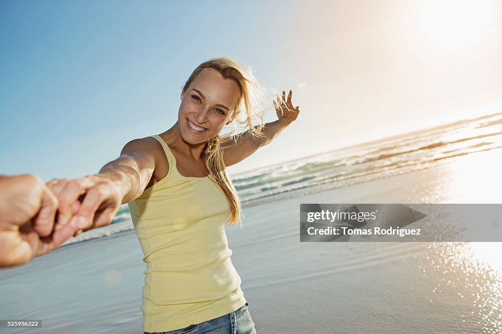 Portrait of young adult woman standing on beach