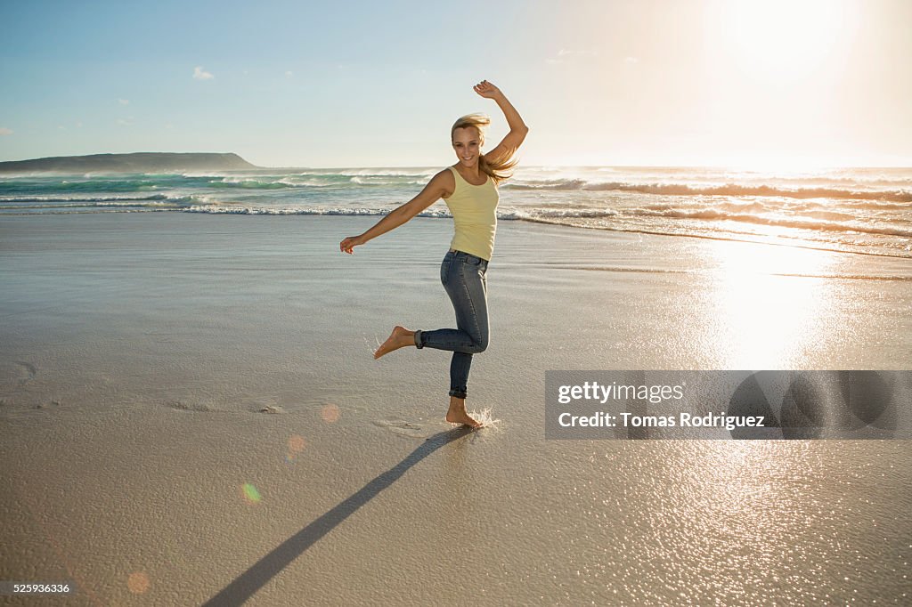 Portrait of young adult woman standing on beach