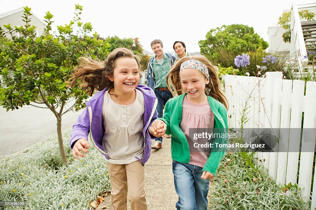 Family taking walk, girls (6-7), (8-9)