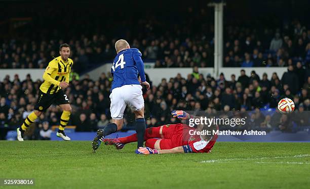 Steven Naismith of Everton is brought down by Marco Wolfli of Young Boys for a penalty