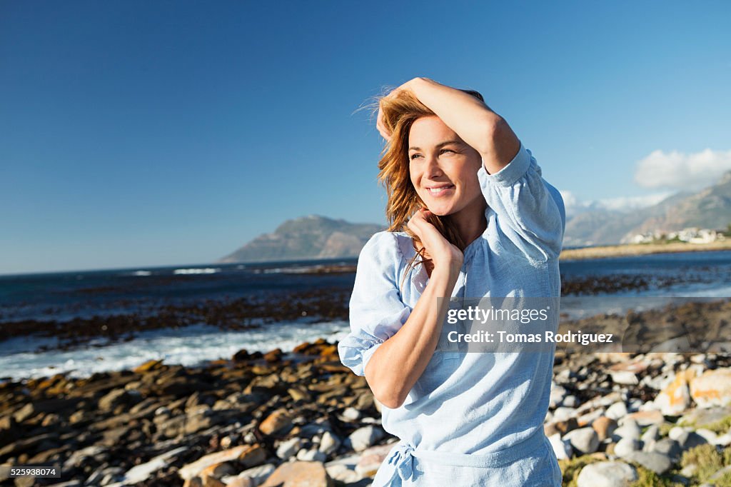 Young woman standing on sea shore