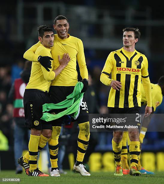 Guillaume Hoarau of Young Boys with Tim Howard of Everton's jersey at full-time