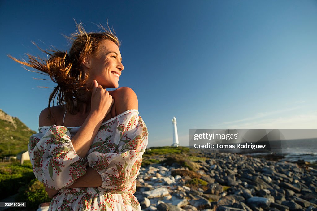 Young woman on rocky beach