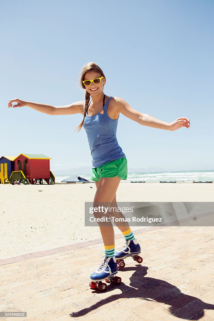 Woman roller skating on beach