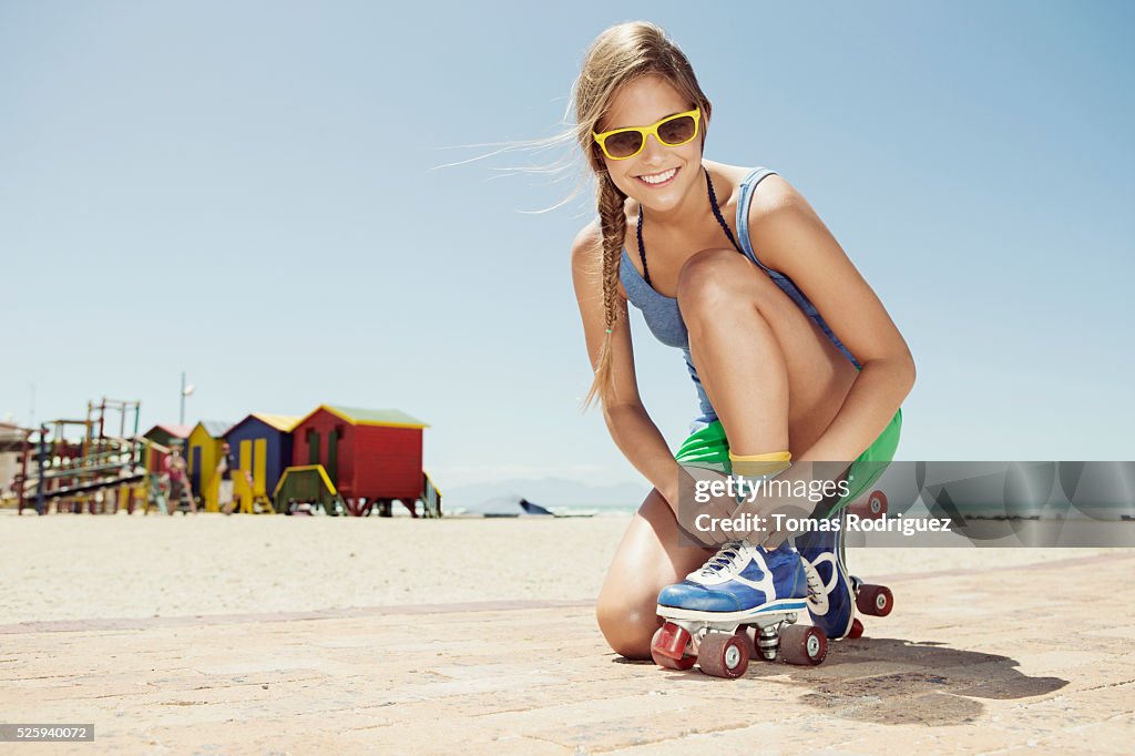 Woman roller skating on beach